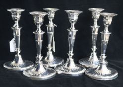 A pair of Victorian silver candlesticks, Sheffield, 1887 and a set of four silver plated