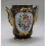 A late 19th century French porcelain two handled vase, on cast gilt metal base