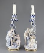 A pair of Meissen figural candlesticks, late 19th century, each modelled with a cherub and a