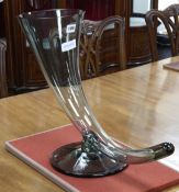 A glass cornucopia vase