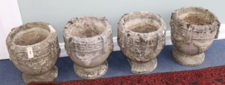 Four stone urns H.40cm