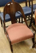 A 19th century Continental mahogany nursing chair