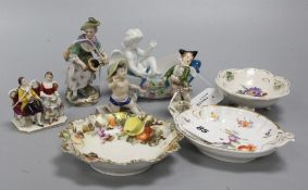 A small late Meissen model of a winged putti with tricorn hat, a similar hurdy-gurdy player and