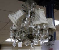 A brass and cut glass chandelier