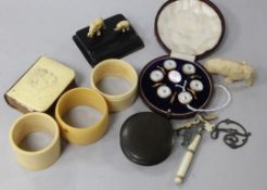 A cased gilt and mother-of-pearl dress set, an ivory-mounted miniature hymn book, a bakelite fire