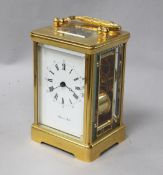 A Mappin & Webb gilt-brass carriage clock, having striking movement with enamelled Roman dial