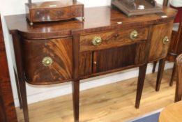 A late Georgian mahogany sideboard, with central tambour compartment W.153cm