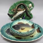 An Alfred Renoleau Palissy style tromp l'oeil platter, modelled with eel, fish shellfish on a leaf-