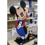 A Walt Disney Mickey Mouse dumb waiter and a small squeezy toy