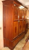 A 1920's inlaid mahogany triple wardrobe, H.211cm