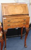 A 1930's marquetry inlaid walnut bureau W.52cm