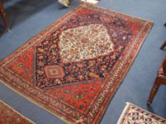 A Shiraz cream ground medallion rug, 196cm x 134cm