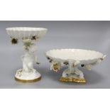 A Moore Bros white-glazed comport with cherub support and a tazza, each with applied decoration of