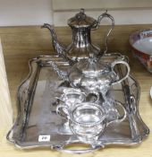 A silver plated two handled tea tray, a plated tea and coffee pot and a plated sugar bowl and