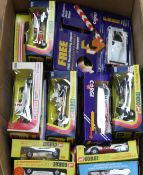 Twenty one Corgi models of racing cars, all boxed