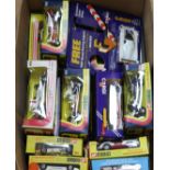 Twenty one Corgi models of racing cars, all boxed