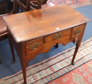 A mid 18th century style oak three drawer lowboy, W.81cm