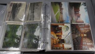 Four albums of postcards and loose postcards