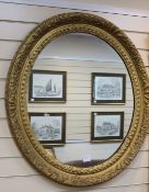 A pair of oval gilt framed wall mirrors, H.93cm