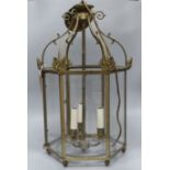 A brass hexagonal hanging hall lantern (one glass panel deficient)