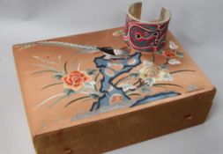 A Chinese embroidered silk jewellery box and a white metal and silk bangle