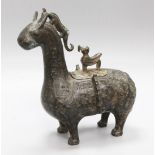 An archaistic bronze animal vessel and cover