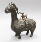 An archaistic bronze animal vessel and cover