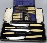 A set of fish knives and forks and a carving set