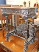 A Flemish carved oak sewing table, W.59cm