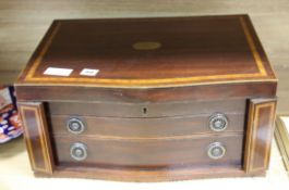 An inlaid mahogany canteen box