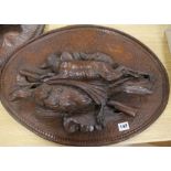 A pair of carved wood plaques