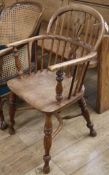 A 19th century elm and ash elbow chair