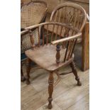 A 19th century elm and ash elbow chair