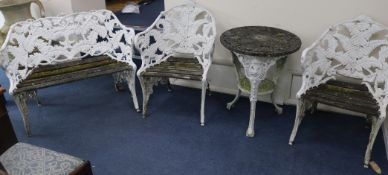 A three piece fern pattern bench set and table, Bench W.110cm