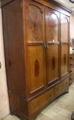 A 1920's inlaid mahogany triple wardrobe, H.211cm