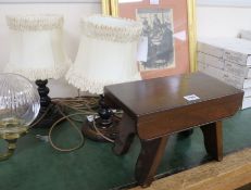 A pair of turned oak table lamps and a stool