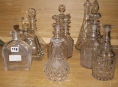 A collection of cut glass decanters