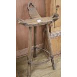 An elm three legged stool, W.50cm