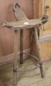 An elm three legged stool, W.50cm