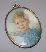 A portrait miniature of a boy and a candelabra stamped 925