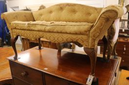 An upholstered button back window seat, W.118cm