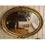 A gilt frame oval wall mirror, H.82cm