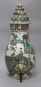 A Chinese famille verte cistern and cover, Kangxi period, damage