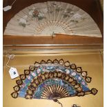 Two Chinese export fans, 19th century, the first a gilt decorated lacquer cabriolet fan, c.1860,