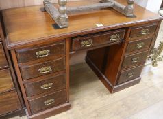 A Victorian walnut kneehole desk, W.122cm