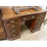 A Victorian walnut kneehole desk, W.122cm