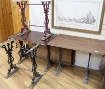 A set of four cast iron base pub tables with rectangular tops