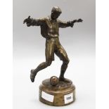 A bronze figure of a footballer