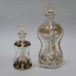 A 19th century gilt decorated decanter and another similar smaller decanter