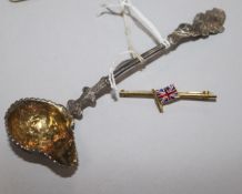 An ornate Victorian silver cream ladle by G.f. Pinell, London, 1846 and a 9ct. gold and enamel Union